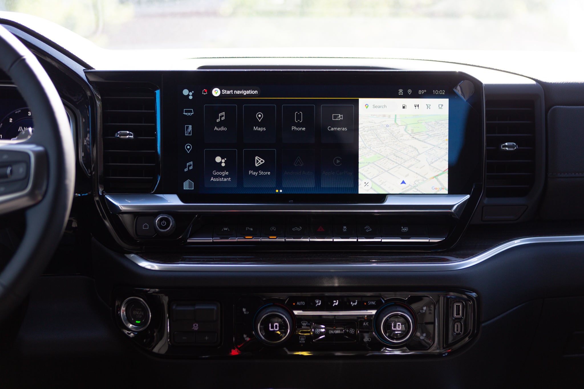 Dashboard display and center console of a modern vehicle.