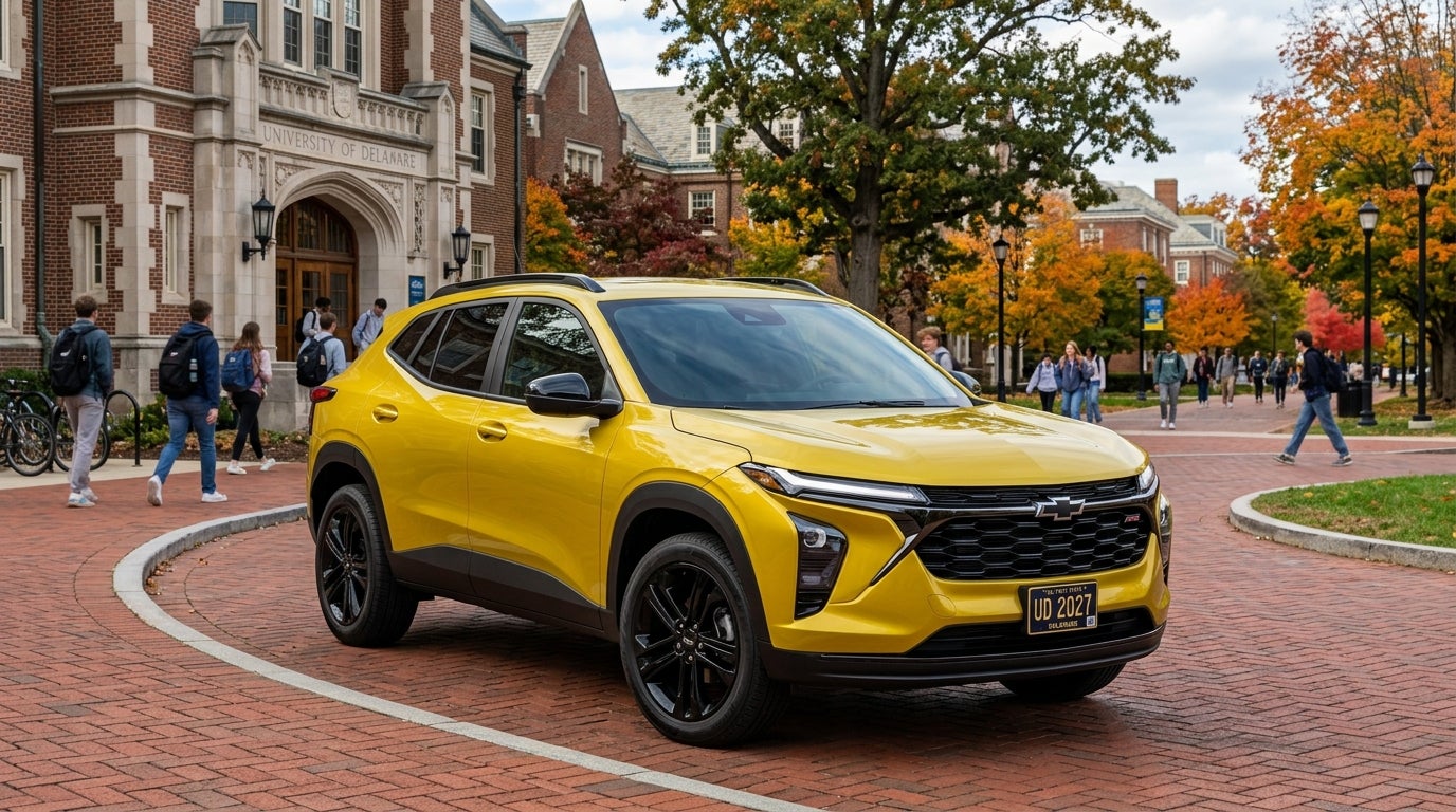 Bright yellow Chevrolet Trax SUV parked on a brick plaza at the University of Delaware campus during autumn. (Representative image for illustration purposes only. Actual vehicle may vary based on trim and configuration.)