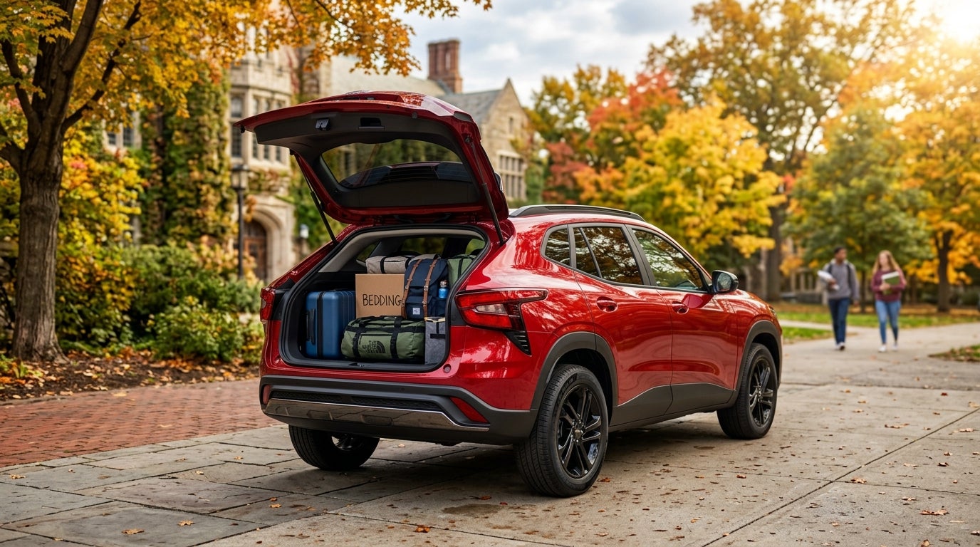 Red SUV parked on a university path during autumn with its open trunk filled with college luggage and bedding boxes. (Representative image for illustration purposes only. Actual vehicle may vary based on trim and configuration.)