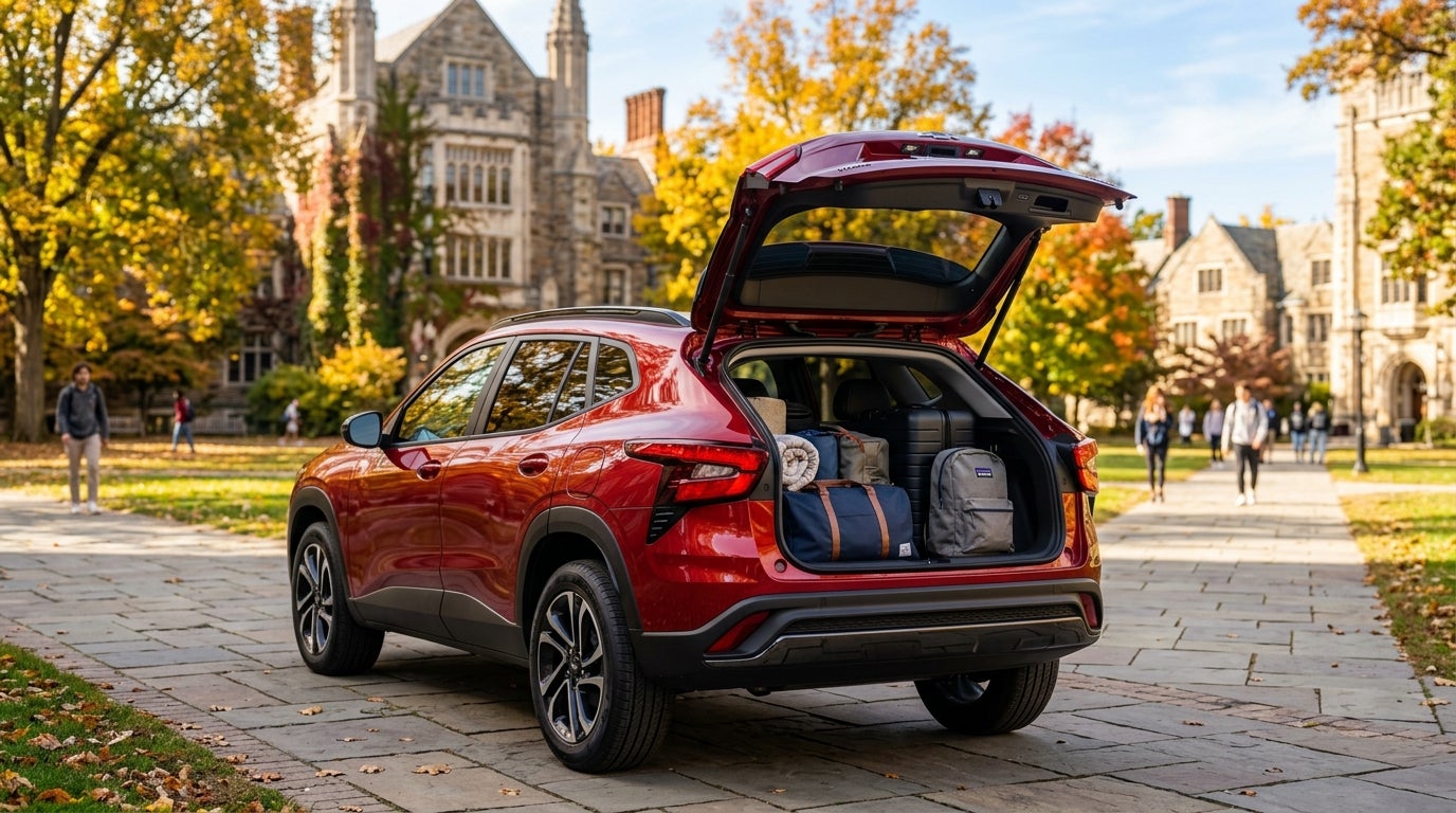 Red SUV parked on a university campus during autumn, with its open trunk packed with luggage and backpacks. (Representative image for illustration purposes only. Actual vehicle may vary based on trim and configuration.)