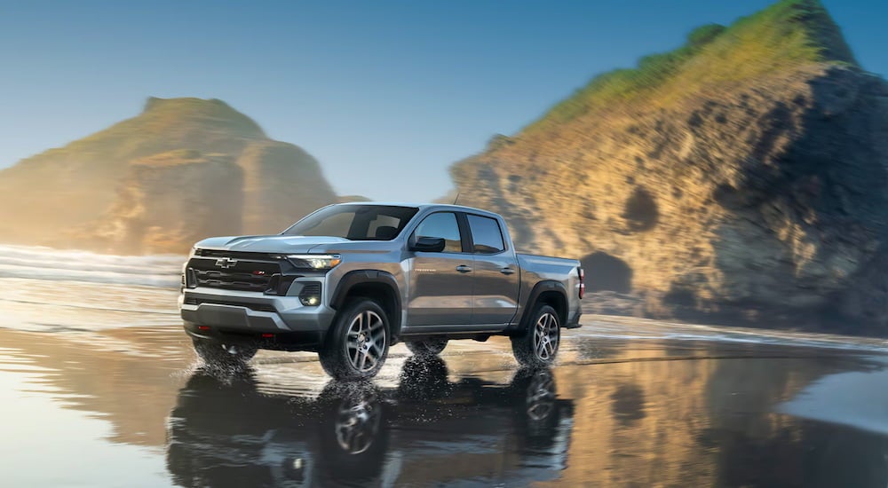 A grey 2025 Chevy Colorado Z71 driving on a beach.