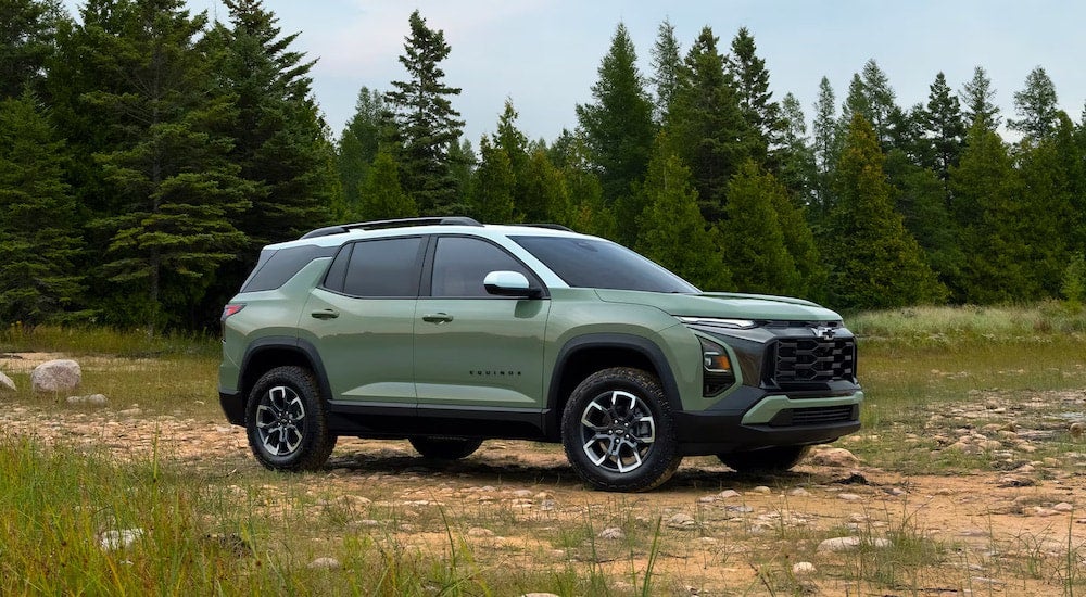 A green 2026 Chevy Equinox from the side.