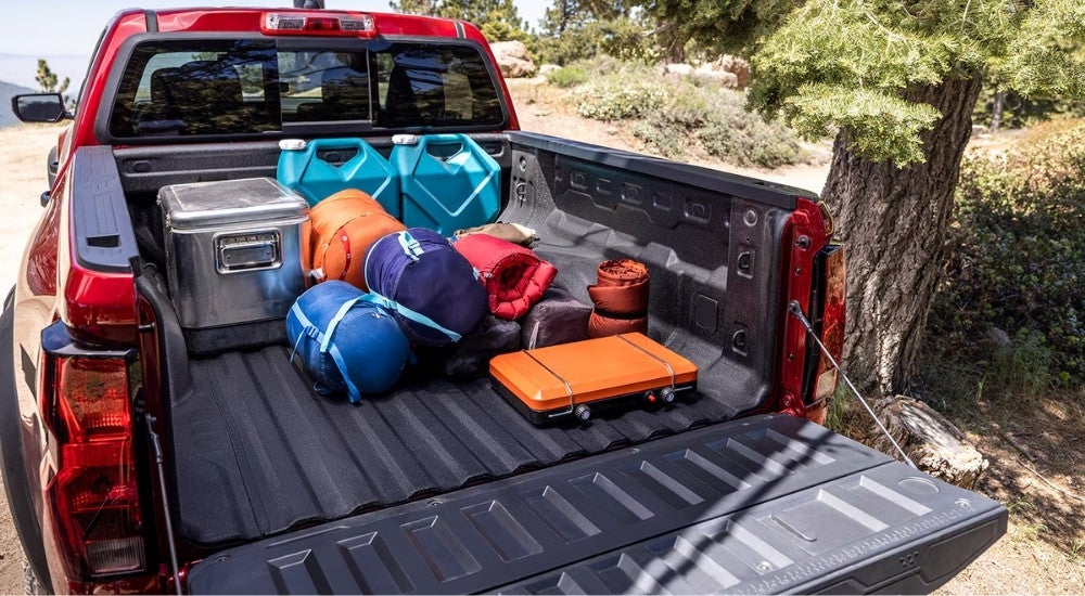Gear in the bad of a red 2025 Chevy Colorado for sale near San Antonio.