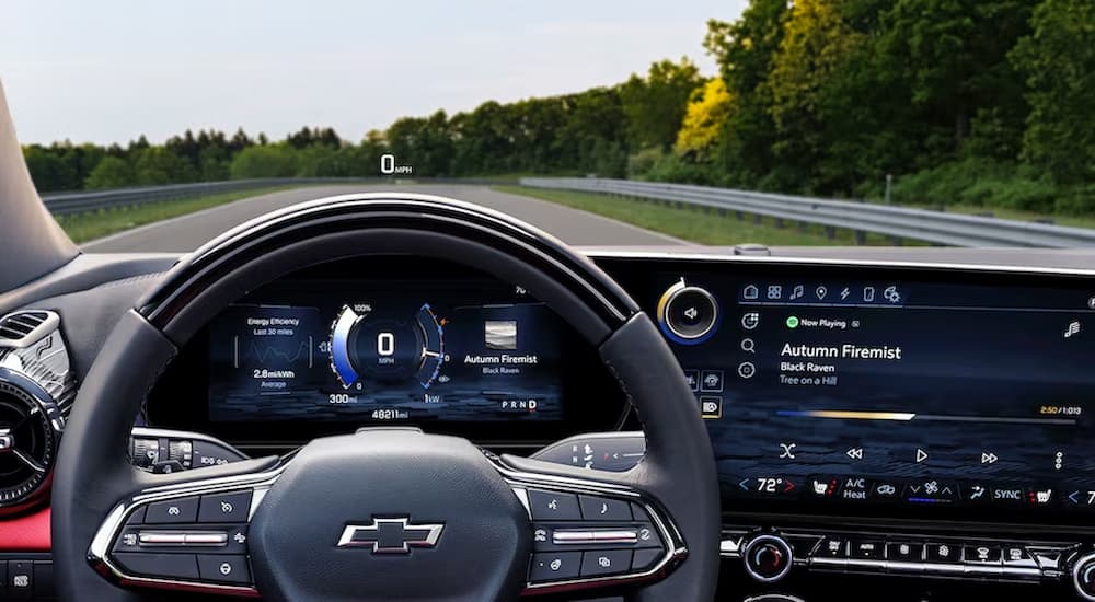Black dashboard and steering wheel in a 2025 Chevy Blazer EV.