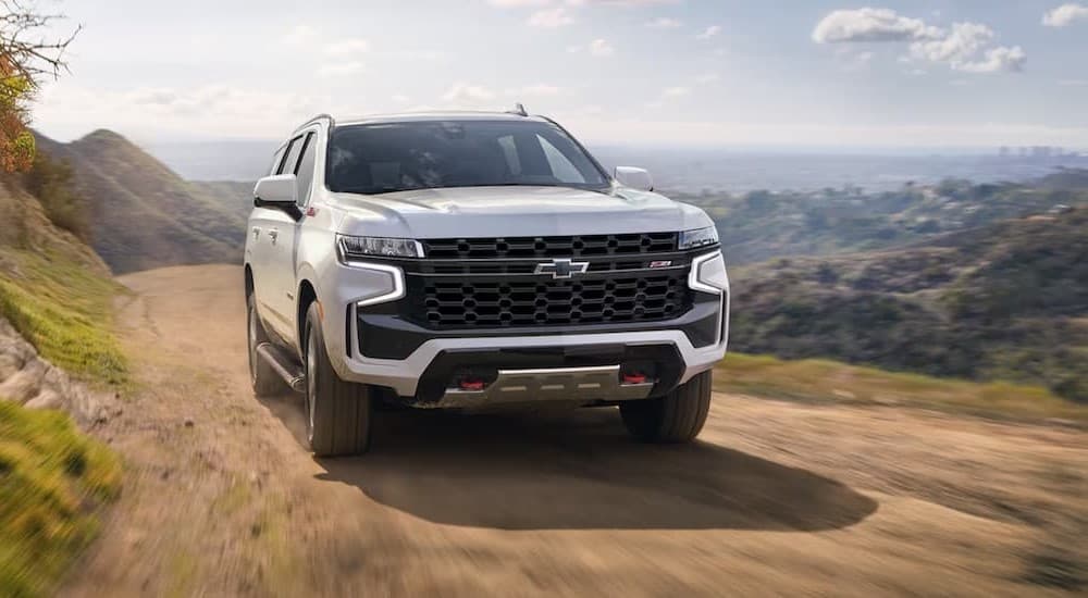 A white 2023 Chevy Tahoe Z71 off-roading.