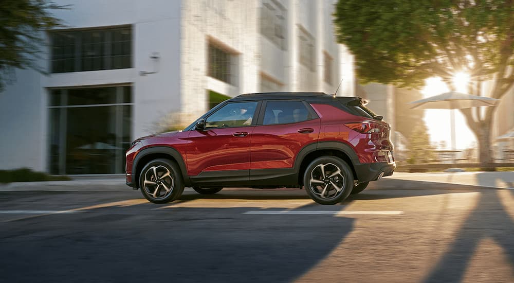 Red 2022 Chevy Trailblazer driving on a city street.