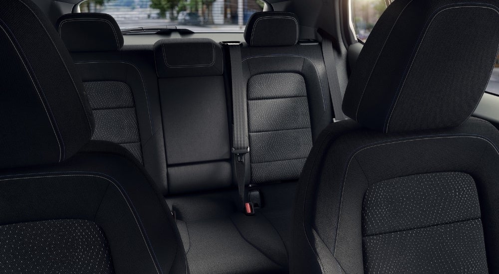 Black rear seats in a 2024 Chevy Equinox EV 1LT.