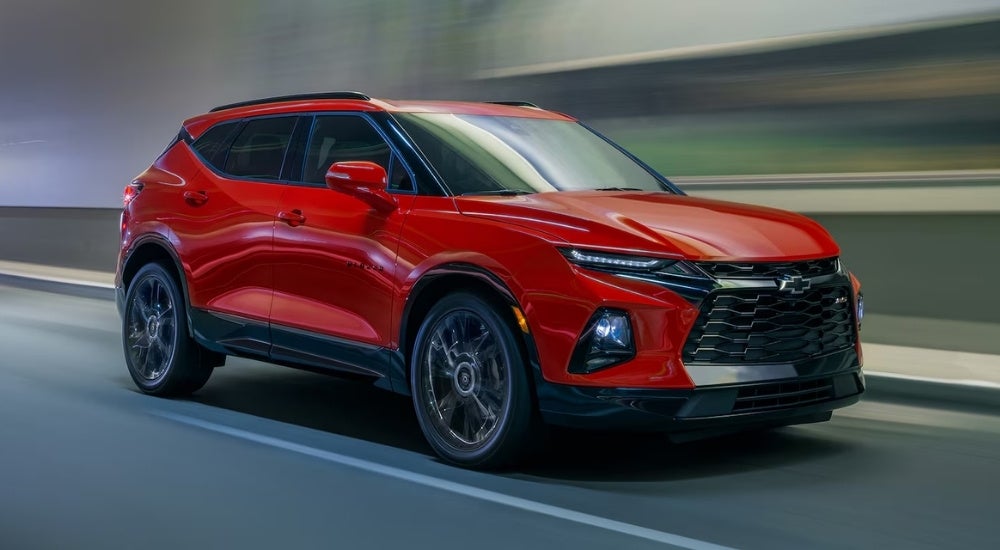 A red 2021 Chevy Blazer driving through a tunnel.