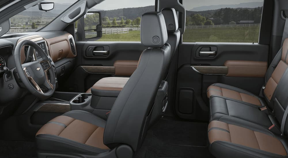 Black and brown interior of a 2023 Chevy Silverado 3500HD.
