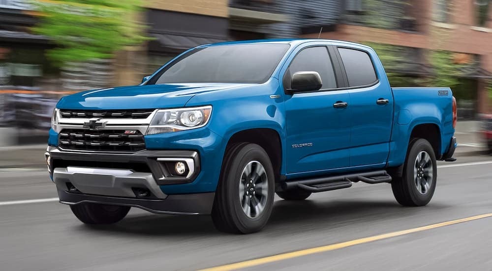 Blue 2022 Chevy Colorado Z71 driving on a city street.