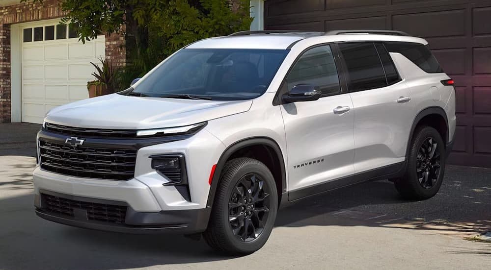 A white 2026 Chevy Traverse parked in a driveway.