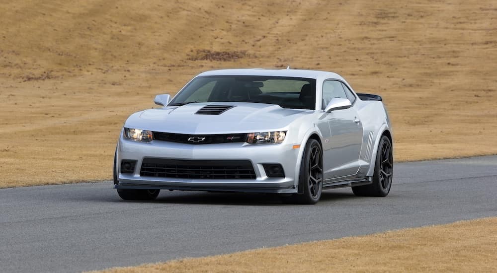 A silver 2015 Chevy Camaro Z28 parked on a sunny day.