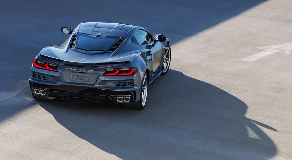 A grey 2024 Chevy Corvette E-Ray from the rear.