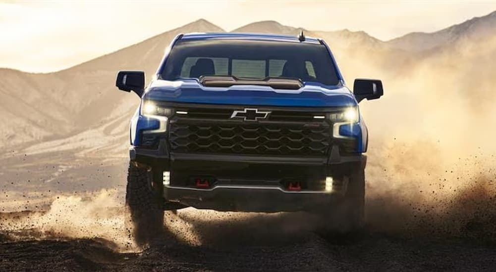 A blue 2026 Chevy Silverado 1500 ZR2 off-roading.