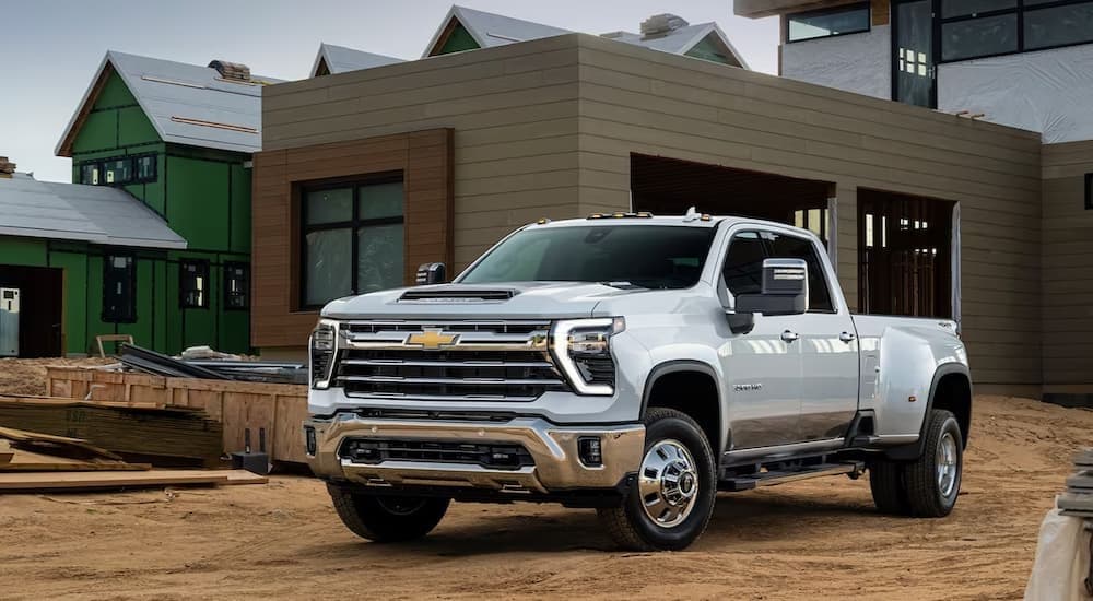 A white 2023 Chevy Silverado 2500 HD parked on dirt.