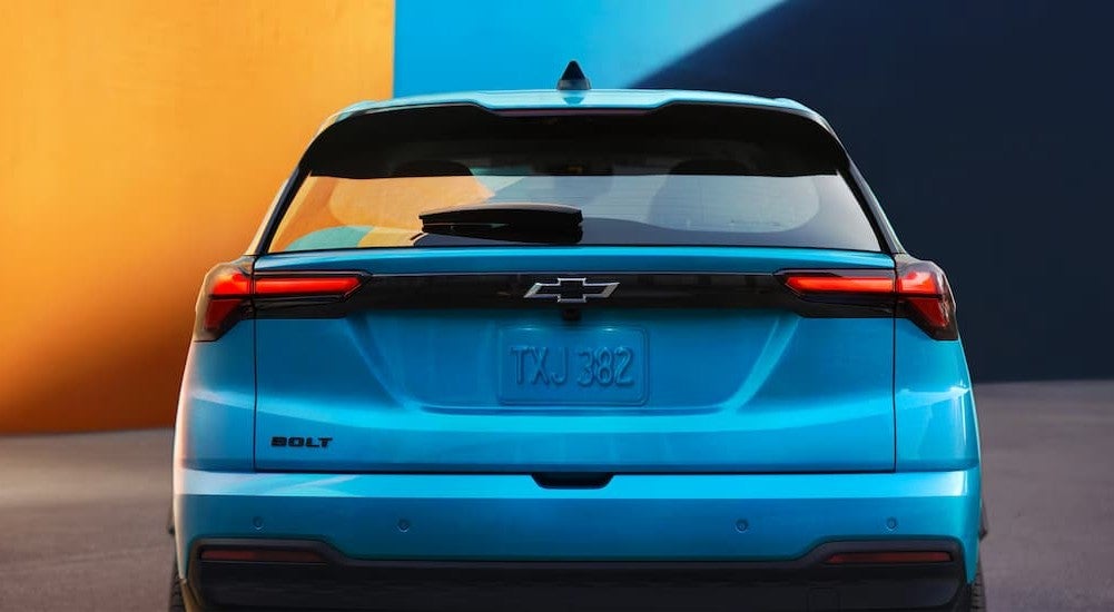 Close-up of the rear-end of a blue 2027 Chevy Bolt.