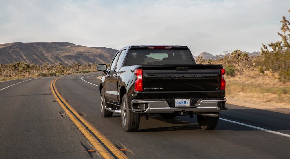 A black 2022 used Chevy Silverado for sale near San Antonio from the rear.