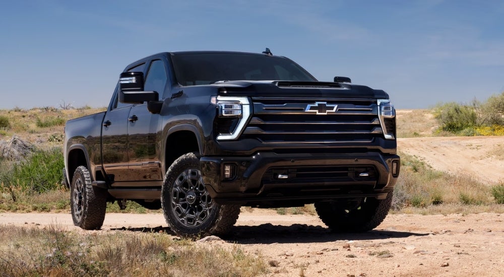 A black 2023 Chevy Silverado 2500 HD from the front.