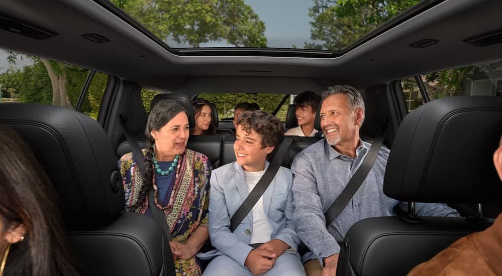 Several passengers in a 2026 Chevy Traverse.