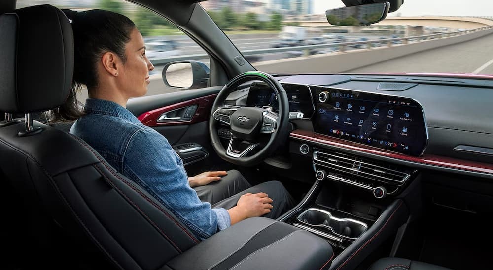 A person hands-free driving in a 2026 Chevy Traverse.