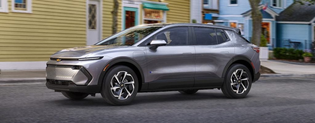 A silver 2024 Chevy Equinox 1LT after leaving a Chevy Equinox EV dealer.