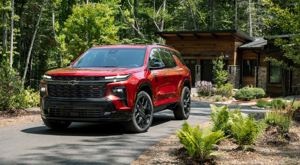 A red 2025 Chevy Traverse for sale from the front.