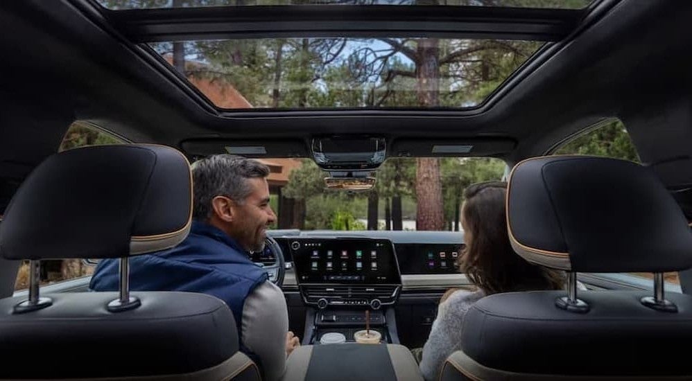 People in the black interior in a 2027 Chevy Silverado 1500.