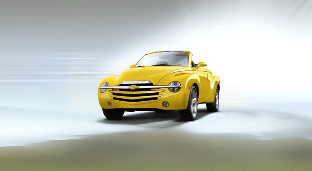 A yellow 2005 Chevy SSR against a light background.