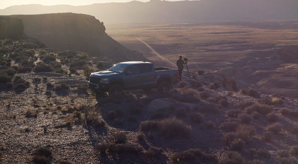 A grey 2021 Chevy Colorado ZR2 parked near a photographer.