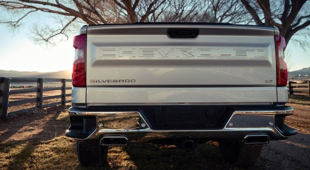 Close-up on the tailgate of a silver 2024 Chevy Silverado 1500 LT.