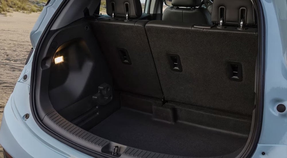 The rear cargo area in a blue 2022 Chevy Bolt EV.
