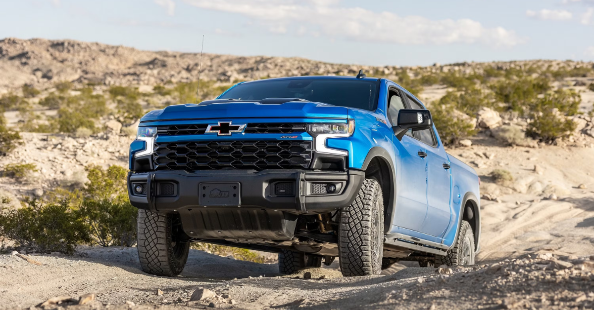 2025 Chevrolet Silverado 1500 Bison edition in blue climbing over a hill