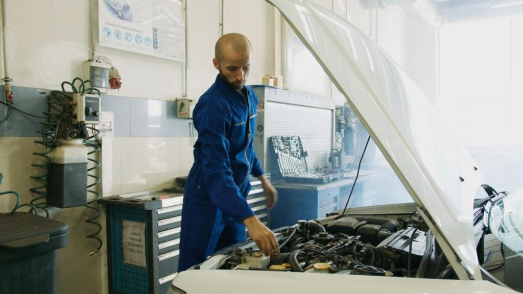 Mechanic working on a Jet Chevrolet Fleet Vehicle