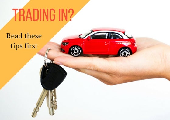 Toy car being held in a hand dangling keys