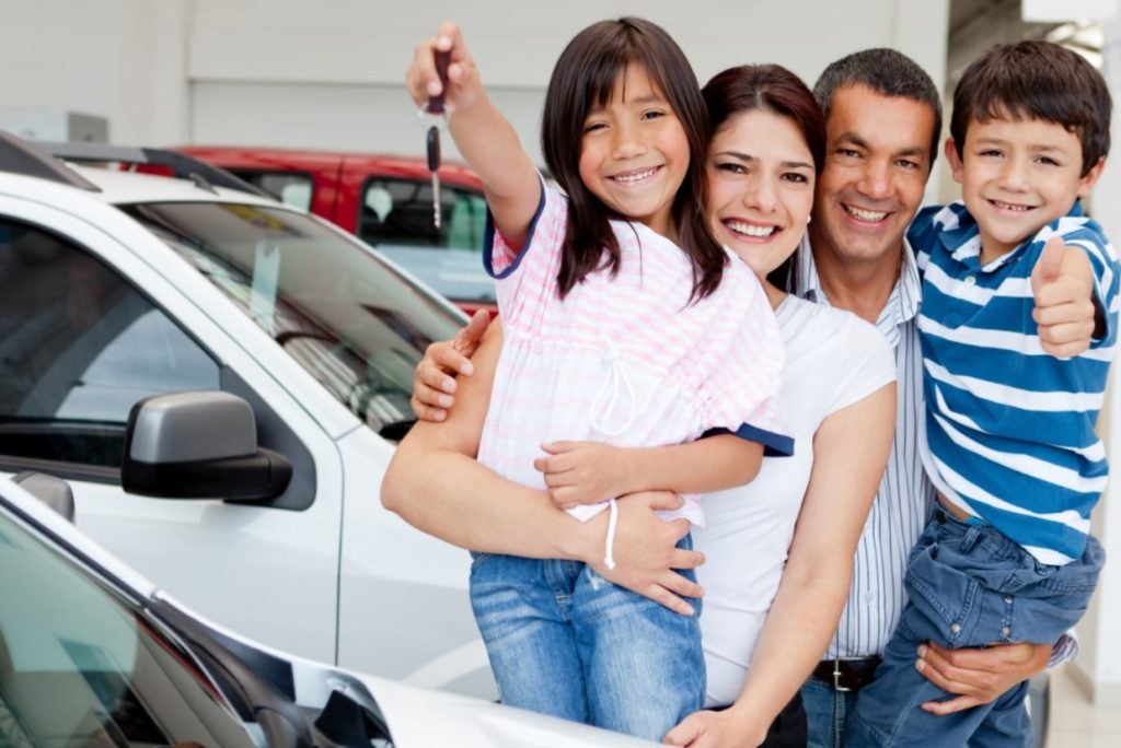 Family at a car dealership