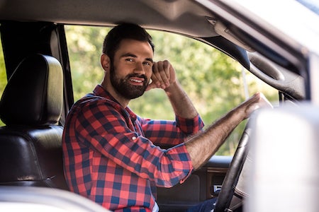 Man behind the wheel of a car