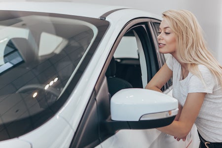 Woman looking at a car
