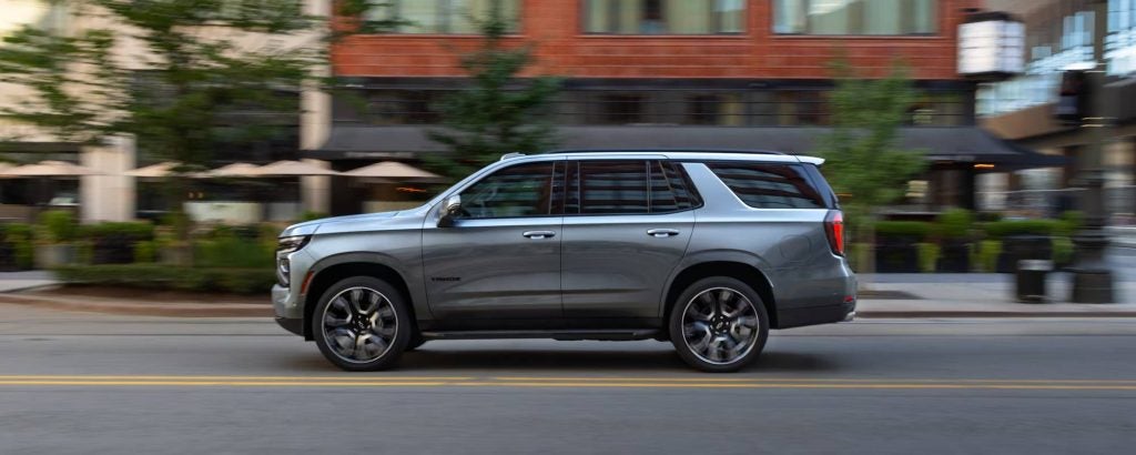 2026 Tahoe driving down a city street