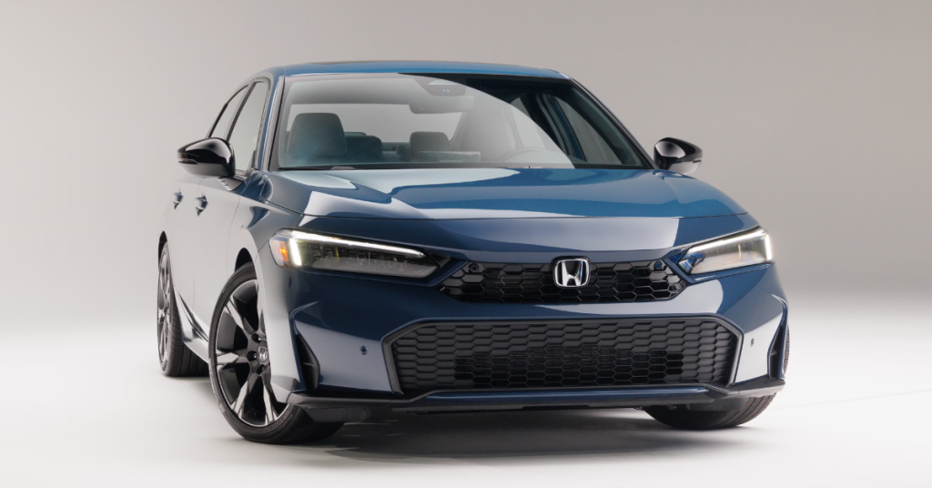2025 Honda Civic Sedan in front of a Grey Background