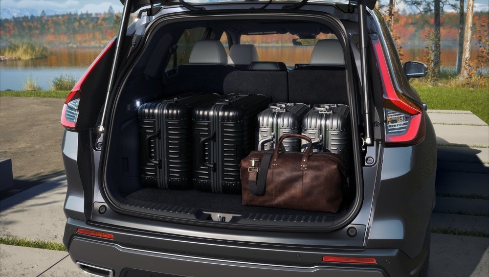 MY26 CR-V Sport Touring Hybrid trunk with suitcases and travel bag