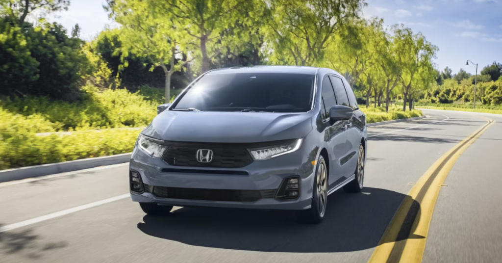 2025 Honda Odyssey Driving Down a Suburban Road