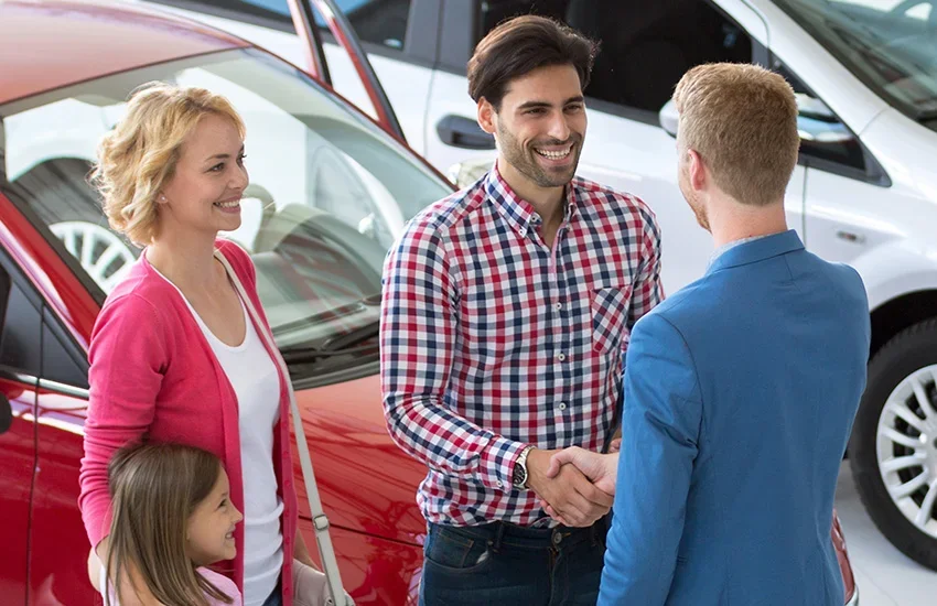 Cecil Clark Chevrolet sales team member with a customer at the dealership in Leesburg, FL, serving The Villages