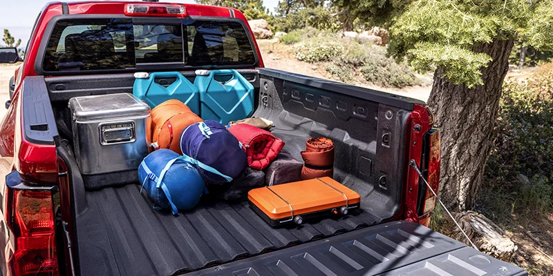 A photograph of a bed of a truck filled with camping supplies near Wind Gap, PA