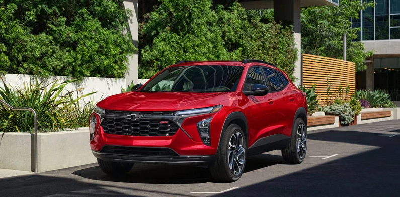 A red 2026 Chevrolet Trax parked on the side of the road.