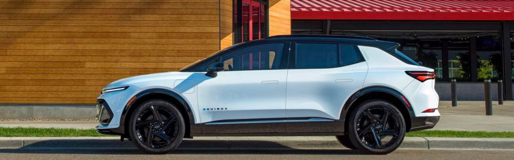 2025 Equinox EV parked in front of a 