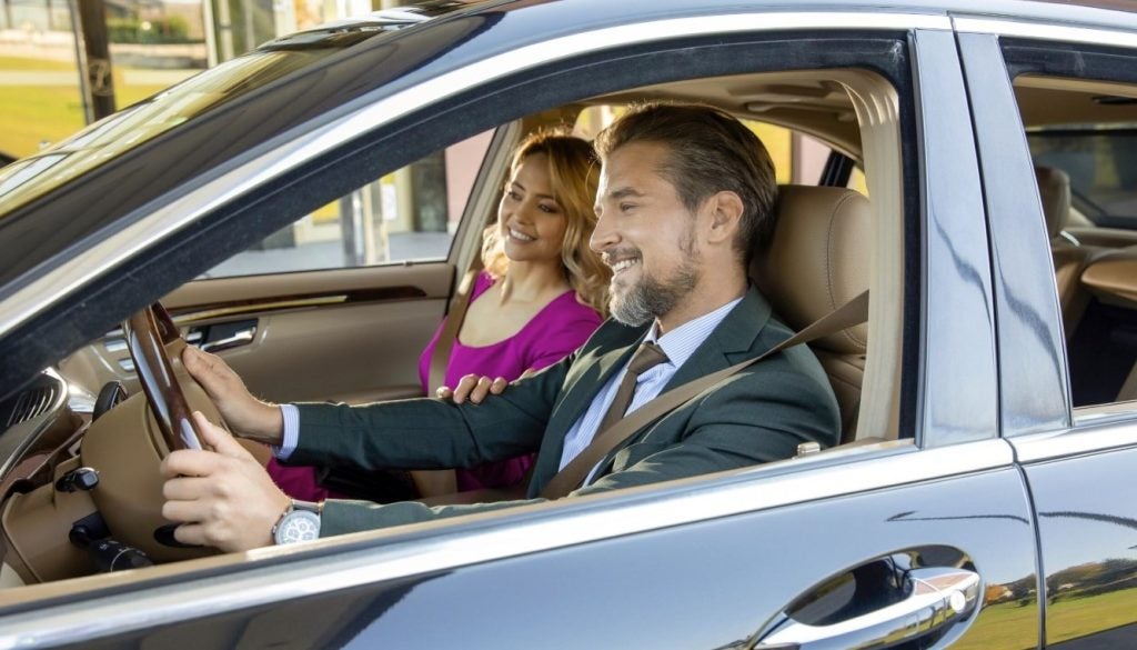 Man and woman inside of an SUV
