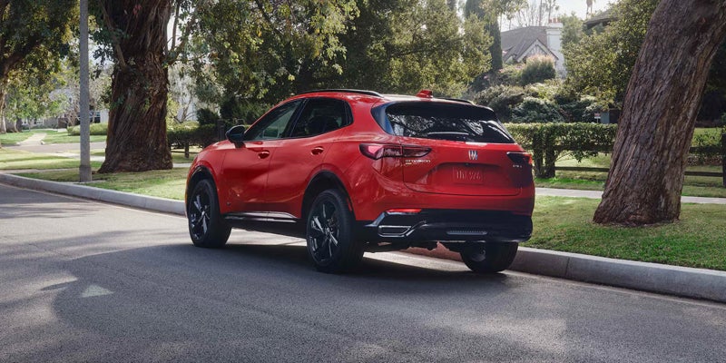 Rear view of a red 2026 Buick Envision showcasing its sleek design and distinctive taillights.