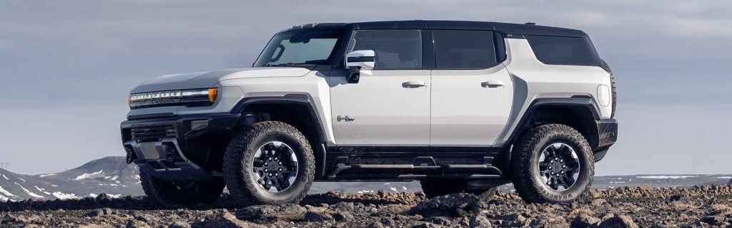 2025 GMC Hummer SUV parked on a rough gravel road