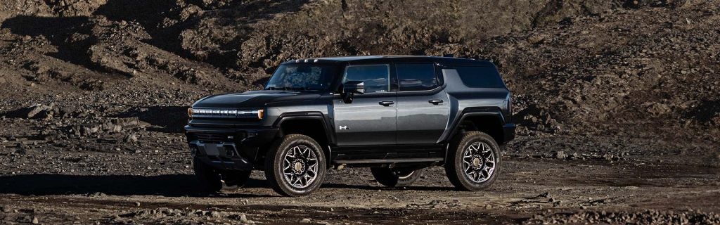 2025 Hummer SUV parked in a rock quarry