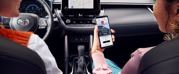 Person in vehicle using Toyota app